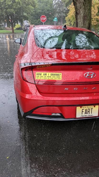 Funny New Jersey license plate reading FART on a red Hyundai Sonata