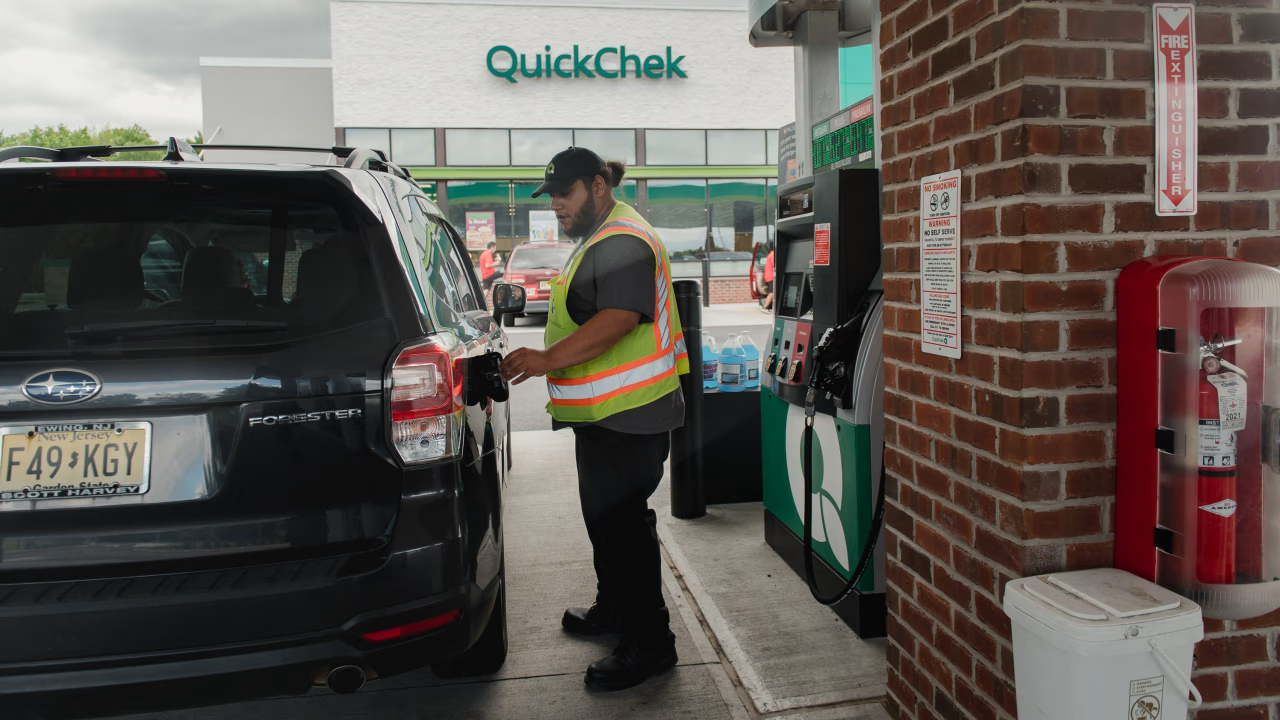 Gas station attendant pumping gas in New Jersey